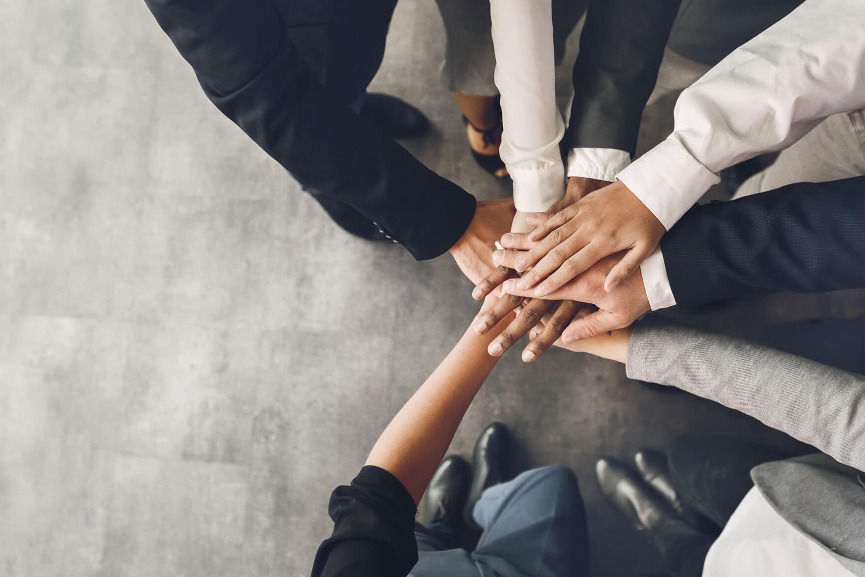 Group of business people hand to hand